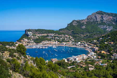 Beautiful view of the Port de Soller coastline. Harbor with many yachts and ships. Mallorca island,...