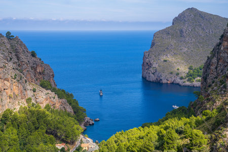 Amazing view of Mallorca, beautiful sea bay with a luxury tourist ship on the coast of Sa Calobra, Mallorca Mediterranean Sea, Balearic Islandsの写真素材