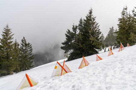 A dangerous ski slope is marked with a red warning sign. Karpacz, Polandの写真素材