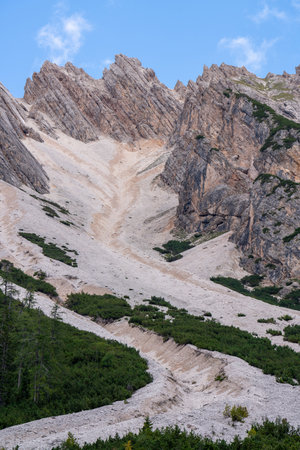 Majestic landscape in the mountains. Dolomites. Italy. Alps. Trails in the mountains. Beautiful rocks and clouds. Beauty of nature. Famous tourist place. High mountains. Rocks.の写真素材