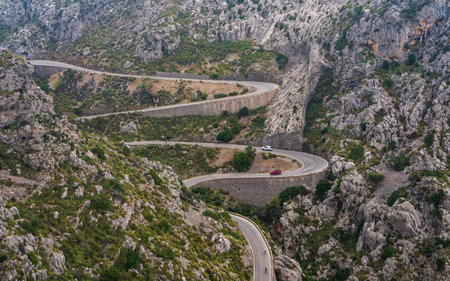 Winding road through rugged Sa Calobra Mountains. Famous tourist destination. Mallorca. Spain