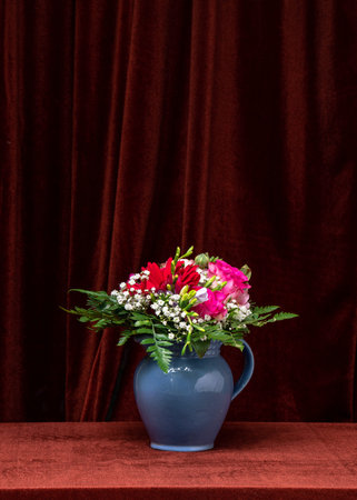 Beautiful bouquet of flowers on a dark fabric background. Space for text, copy space. Still lifeの写真素材