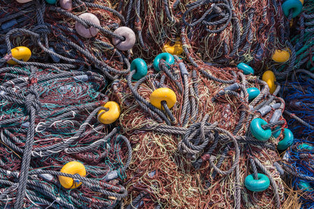 Lots of colorful fishing nets left in the port. Port de Soler, Mallorca, Spain