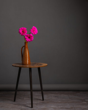 Minimalist decor, bouquet of flowers in vase on round table.の写真素材