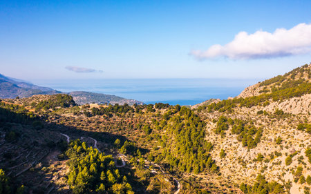Picturesque aerial view Tramuntana mountain range under blue sky. Beauty of Mallorca, Balearic Islands, Spainの写真素材