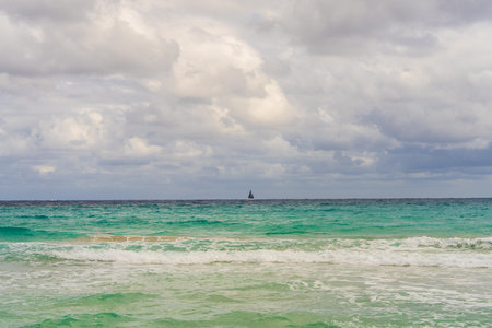 Yacht with black sails moving across endless turquoise sea. Concept of freedom, adventure, luxury...