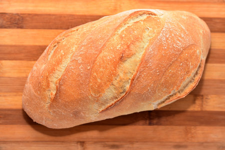 Fresh bread on wood background