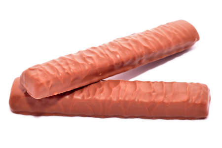 Pieces of chocolate with caramel isolated on whiteの写真素材