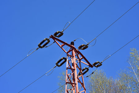 High voltage tower with blue sky on background
