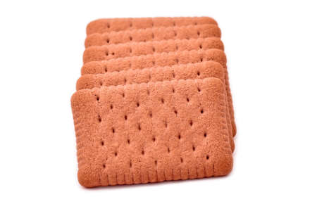 Brown biscuits with cocoa isolated on whiteの写真素材