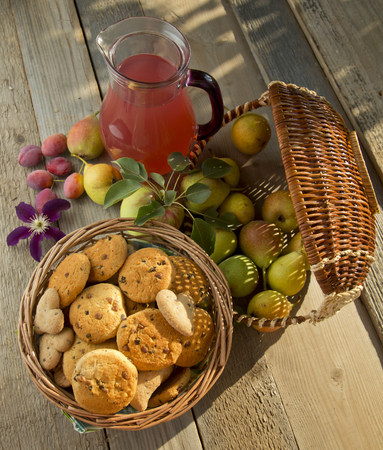 Still life with Cookies and fruits in a gardenの写真素材