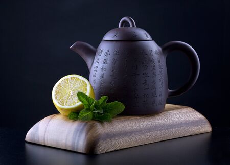 The Chinese teapot with a lemon and mintの写真素材