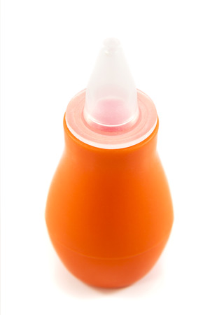 Orange aspirator suction mucus during rhinitis nose babies on a white backgroundの写真素材