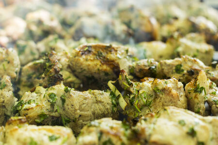 Meat slices with vegetables prepares on fireの写真素材