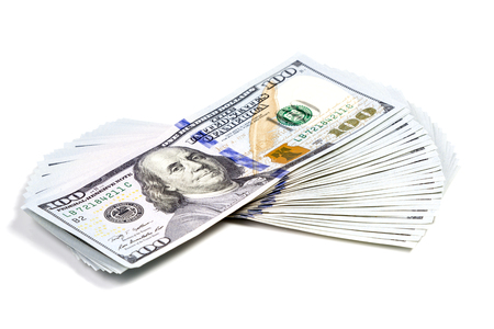 Hundred dollar bill put shifted stack isolated on white backgroundの写真素材