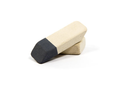 Two different types of erasers lying on each other isolated on white backgroundの写真素材