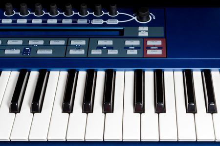 Fragment blue electric music synthesizer with a set of buttonsの写真素材