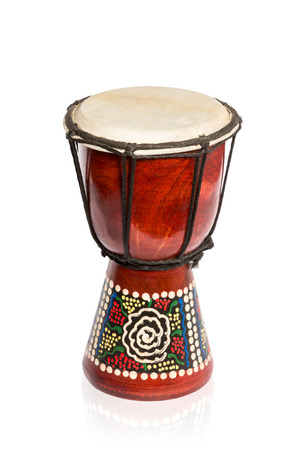 African ethnic wooden handmade red drum isolated on a white backgroundの写真素材