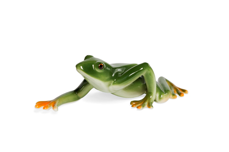Glass figurine green frog crawling side view isolated on white backgroundの写真素材