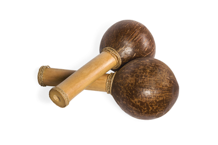 Two wooden maracas from brown nut shell isolated on white backgroundの写真素材