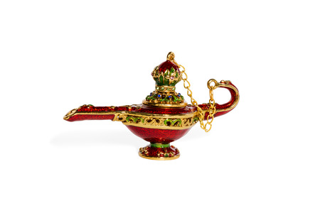 Red ceramic Aladdin magic lamp with a cover on a chain isolated on a white backgroundの写真素材