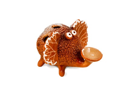 Brown ceramic figurine funny elephant isolated on a white backgroundの写真素材
