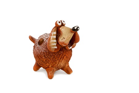 Decorative ceramic figurines gift dog isolated on a white backgroundの写真素材