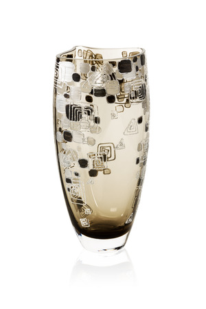 Decorative glass vase for flowers with dark colors isolated on white backgroundの写真素材