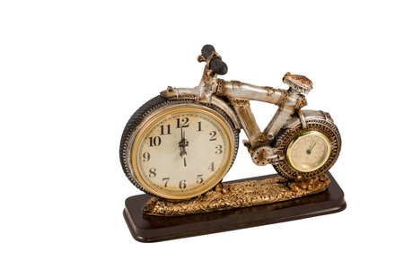 Gift decorative statuette bicycle with clock and thermometer instead of wheels isolated on a white backgroundの写真素材