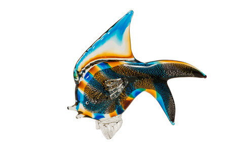 Souvenir figurine colored glass fish isolated on a white backgroundの写真素材