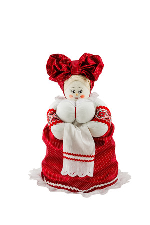 Russian rag doll with big breasts in red dress isolated on white backgroundの写真素材