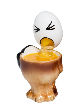 Egg with a painted human face feel sick in a cup isolated on a white backgroundの写真素材