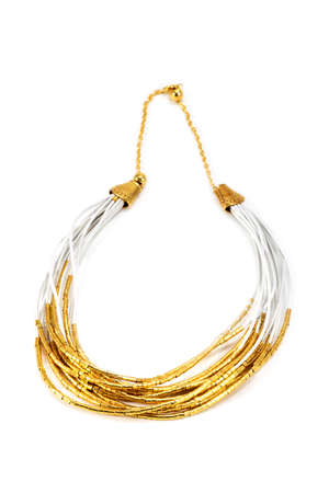 Necklace handmade gold color on leather ribbons isolated on a white backgroundの写真素材