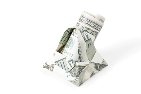 Basket origami made of hundred dollar bills with dollars twisted into a tube inside isolated on white backgroundの写真素材
