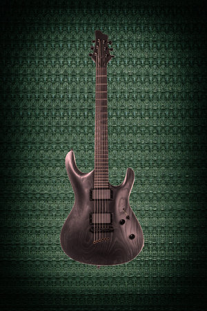 Beautiful black wooden electric guitar on green abstract techno backgroundの写真素材