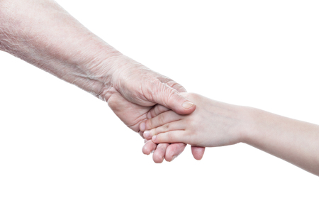 Handshake between grandmother hand and arm granddaughter isolated on white backgroundの写真素材