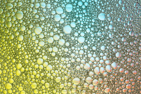 Abstract background of foam close-up with multicolored stains