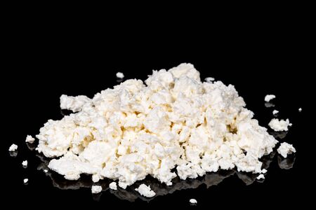 Pile of delicious homemade cottage cheese on a black backgroundの写真素材
