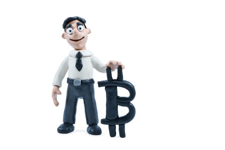 Plasticine businessman in shirt and tie next to plasticine bitcoin sign isolated on white backgroundの写真素材