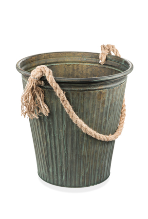 Vintage ornamental iron bucket with a rope handle isolated on white backgroundの写真素材