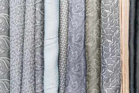 Samples of fabric - tapestry of different colors on the display case