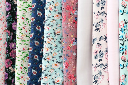 Samples of fabric - printed linen with flowers of different colors on the display case