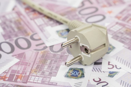 electric plug with a wire on the money with a face value of five hundred euroの写真素材