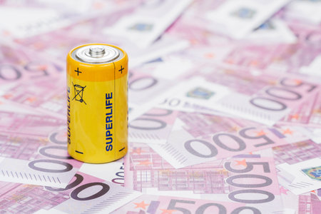Big yellow battery on the money in denominations of five hundred euro