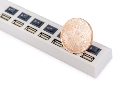 Bitcoin souvenir coins on the bar with usb connectors isolated on white backgroundの写真素材