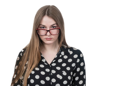 portrait of a serious beautiful business woman with glasses isolated on white background