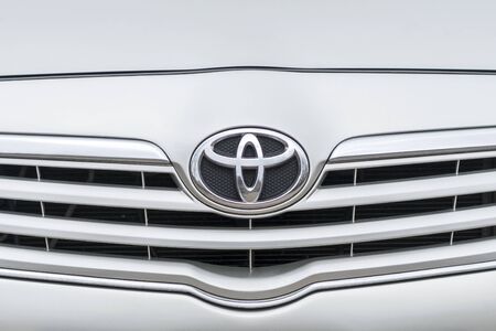 UKRAINE, KHARKOV - MARCH 20, 2019: Toyota emblem on the front grill of the car, close-upのeditorial素材