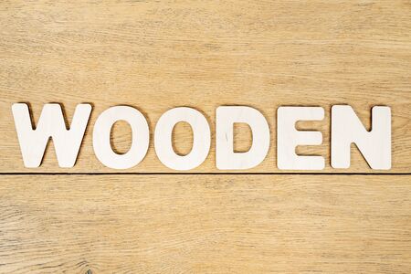 wooden word made from wooden letters on an old tableの写真素材