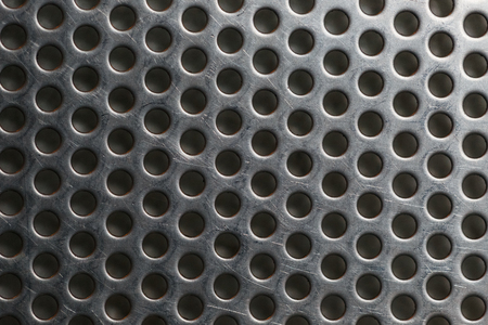 Silver metal shaped like a honeycomb for design background.の写真素材