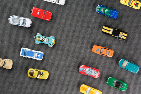 Colorful automotive toys. The apartment was lying, on a gray backgroundの写真素材